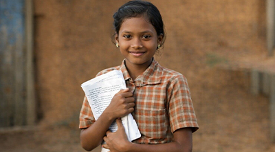 Hands holding a heart symbol, representing donations supporting vulnerable children and young people.